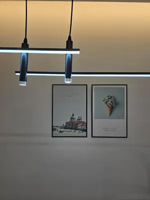 a row of framed pictures hanging on a wall at Razak Residence B2-43 RC Kuala Lumpur in Kuala Lumpur