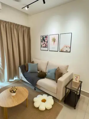 a living room with a couch and a table at Razak Residence B2-43 RC Kuala Lumpur in Kuala Lumpur