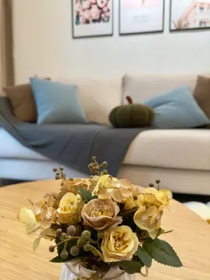 a vase of flowers on a table in a living room at Razak Residence B2-43 RC Kuala Lumpur in Kuala Lumpur