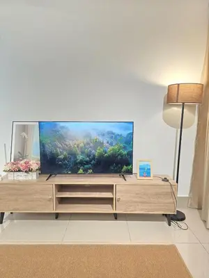 a living room with a large flat screen tv at Razak Residence B2-43 RC Kuala Lumpur in Kuala Lumpur