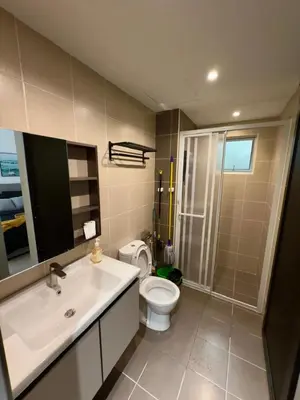 a bathroom with a toilet and a sink and a shower at Razak Residence B2-43 RC Kuala Lumpur in Kuala Lumpur