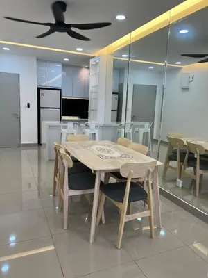 a table and chairs in a room with a ceiling fan at NaBella Homestay LSH33 Sentul in Kuala Lumpur