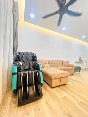 a living room with a couch and a ceiling fan at NaBella Homestay LSH33 Sentul in Kuala Lumpur
