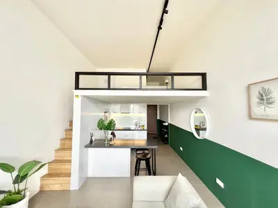a loft apartment with a kitchen and a loft bed at KL Sentral Service Apartment-The Establishment KL Sentral EST in Kuala Lumpur