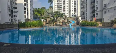 a large swimming pool in a city with tall buildings at Pantai Hillpark phase 5 in Kuala Lumpur