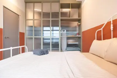 a bedroom with a large white bed in a room at ASTORIA Ampang Apt Designer Condo in Kuala Lumpur