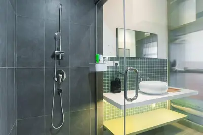 a bathroom with a shower and a sink at ASTORIA Ampang Apt Designer Condo in Kuala Lumpur