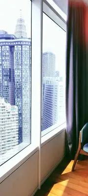 a room with a window with a view of a city at Vortex KLCC by Family Suites in Kuala Lumpur