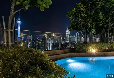 a view of theuckland city skyline at night with a swimming pool at The Robertson by Kuala Lumpur in Kuala Lumpur