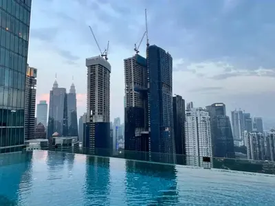 a swimming pool on top of a city skyline at Dorsett Bukit Bintang 5min to Pavilion KL in Kuala Lumpur