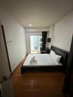 a bedroom with a bed with two towels on it at Parkview 2bedroom apartment klcc in Kuala Lumpur