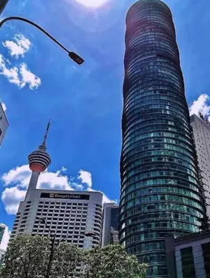 a tall glass building with the view of the cresentivatedivated city at Parkview 2bedroom apartment klcc in Kuala Lumpur