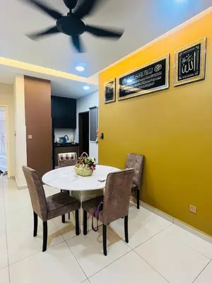 a dining room with a table and chairs and a ceiling fan at Vista Sentul Residence in Kuala Lumpur