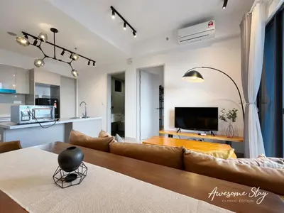 a living room with a couch and a table at Trion KL By Holidayhome in Kuala Lumpur