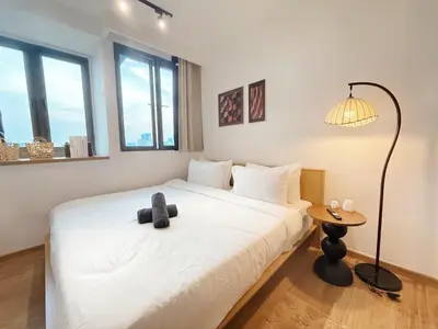 a bedroom with a bed with a teddy bear on it at Cozy Studio I Riveria City I 1km to KL Sentral in Kuala Lumpur