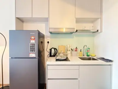 a kitchen with a refrigerator and a sink at Cozy Studio I Riveria City I 1km to KL Sentral in Kuala Lumpur