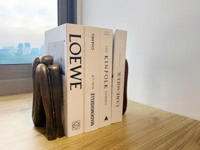 a stack of books sitting on a table at Cozy Studio I Riveria City I 1km to KL Sentral in Kuala Lumpur