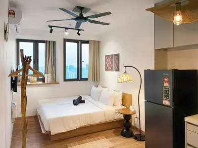 a bedroom with a bed with a ceiling fan at Cozy Studio I Riveria City I 1km to KL Sentral in Kuala Lumpur