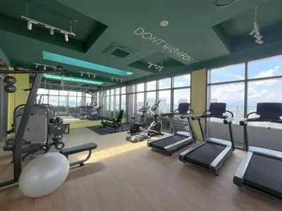 a gym with treadmills and exercise equipment in a building at Cozy Studio I Riveria City I 1km to KL Sentral in Kuala Lumpur