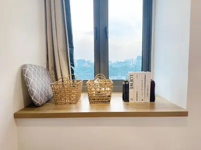 a window sill with three baskets and books on it at Cozy Studio I Riveria City I 1km to KL Sentral in Kuala Lumpur