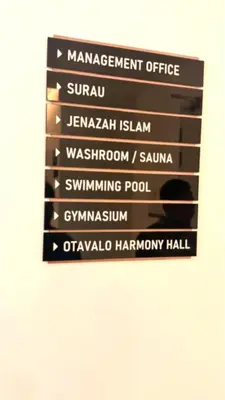 a sign that saysmanagement office in different languages at Majestic Alaman Suites KLCC in Kuala Lumpur