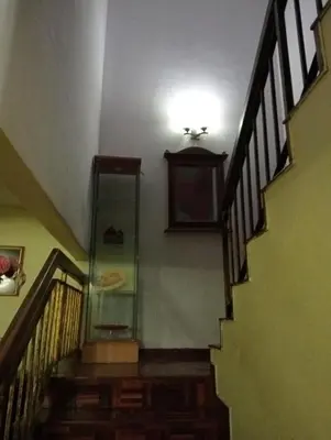 a staircase with a glass cabinet in a house at have fun staying here in Kuala Lumpur