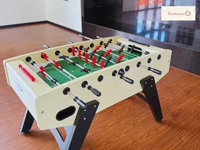 a wooden foosball table with darts on it at KLCC View & Netflix & Walk to LRT & Sunway Putra in Kuala Lumpur