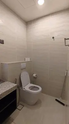 a bathroom with a white toilet in a room at Star Residence KLCC By LLKOK in Kuala Lumpur