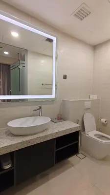 a bathroom with a sink and a toilet and a mirror at Star Residence KLCC By LLKOK in Kuala Lumpur