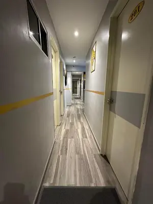 an empty hallway with a long corridor at SS Grey House Bukit Bintang in Kuala Lumpur