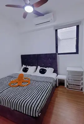 a bedroom with a bed with a ceiling fan at M VERTICA Isyak Homestay in Kuala Lumpur