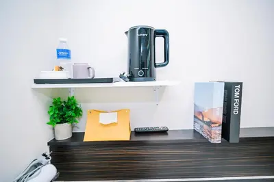 a coffee machine sitting on a shelf in a room at Swing & Pillows - Sungei Wang Bukit Bintang in Kuala Lumpur