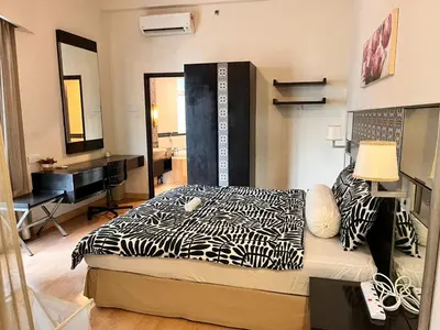 a bedroom with a bed and a sink in it at Seri Bukit Ceylon Bukit Bintang in Kuala Lumpur