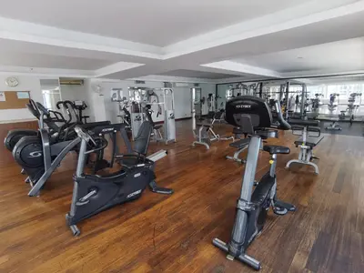 a gym with several treadmills and exercise bikes at Seri Bukit Ceylon Bukit Bintang in Kuala Lumpur