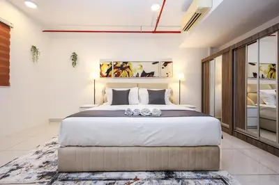 a bedroom with a large bed in a room at Heaven Suites KL in Kuala Lumpur