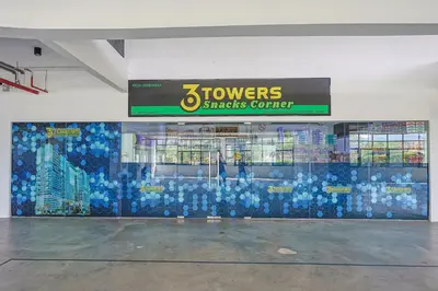 a building with a wall covered in blue tiles at Heaven Suites KL in Kuala Lumpur