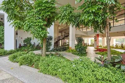 a building with trees and plants in front of it at Heaven Suites KL in Kuala Lumpur