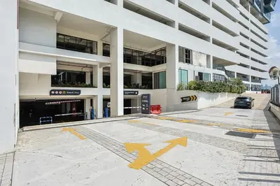an empty parking lot in front of a building at Heaven Suites KL in Kuala Lumpur