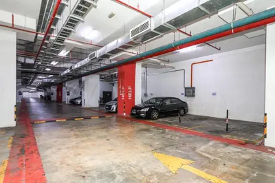 a parking garage with a car parked in it at Heaven Suites KL in Kuala Lumpur