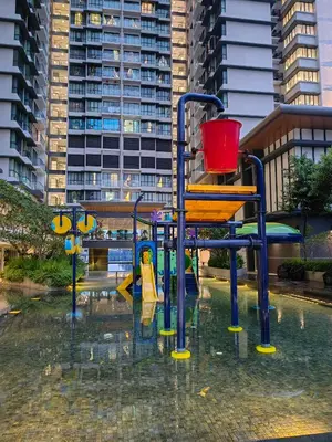 a playground in the water in a city at Service Apartment Sunway Velocity in Kuala Lumpur
