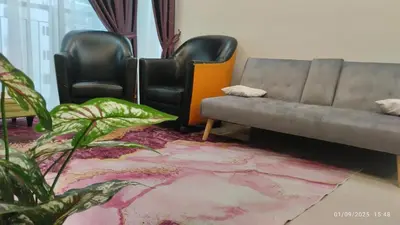 a living room with two chairs and a couch at Setapak KL Apt 2 Room Mus'lim in Kuala Lumpur