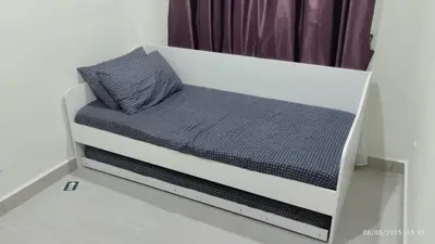 a bed with two pillows on it in a room at Setapak KL Apt 2 Room Mus'lim in Kuala Lumpur