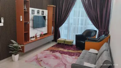 a living room with a couch and a television at Setapak KL Apt 2 Room Mus'lim in Kuala Lumpur