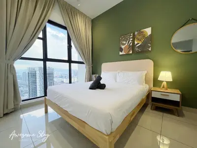 a bedroom with a bed with a teddy bear on it at Trion KL By The Relaxstay in Kuala Lumpur