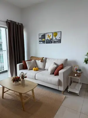 a living room with a white couch and a table at Razak City Kuala Lumpur A2-30 in Kuala Lumpur