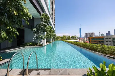 a swimming pool on the side of a building at Trion Kuala Lumpur by Vivid Stay in Kuala Lumpur