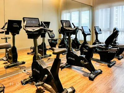 a gym with a bunch of treadmills and exercise bikes at SBR1B Hozem KL2601 Apartment Bukit Bintang in Kuala Lumpur