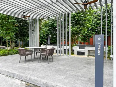 a patio with a table and chairs under a pergola at 2BR1B Hozem KL4409 Apartment Bukit Bintang in Kuala Lumpur