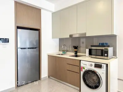 a kitchen with a washing machine and a microwave at 2BR2B Hozem KL2708 Apartment Bukit Bintang in Kuala Lumpur