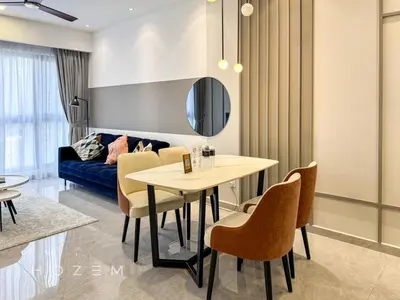 a dining room with a table and chairs and a couch at 2BR2B Hozem KL1713 Apartment Bukit Bintang in Kuala Lumpur